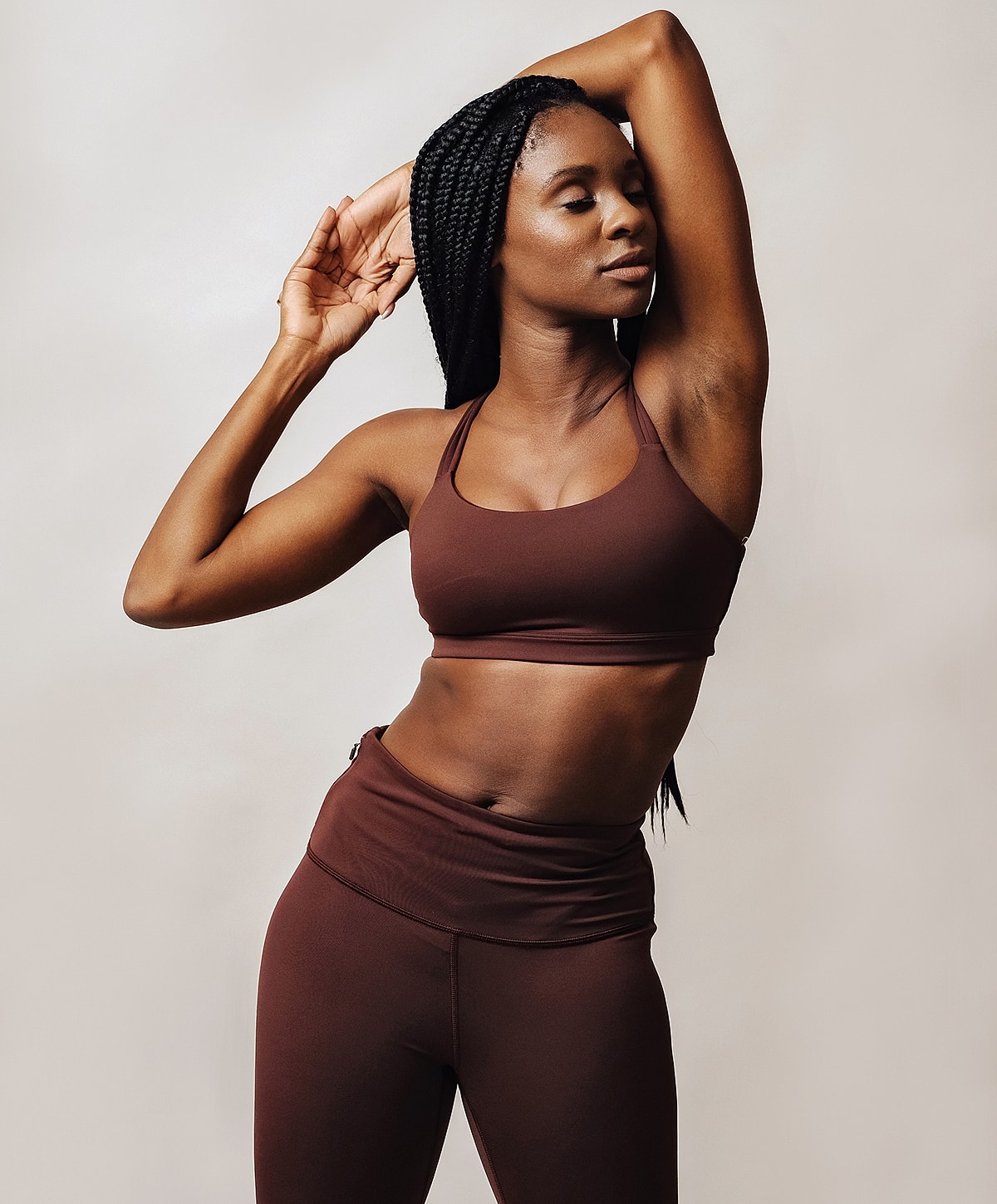 Woman in activewear posing gracefully.