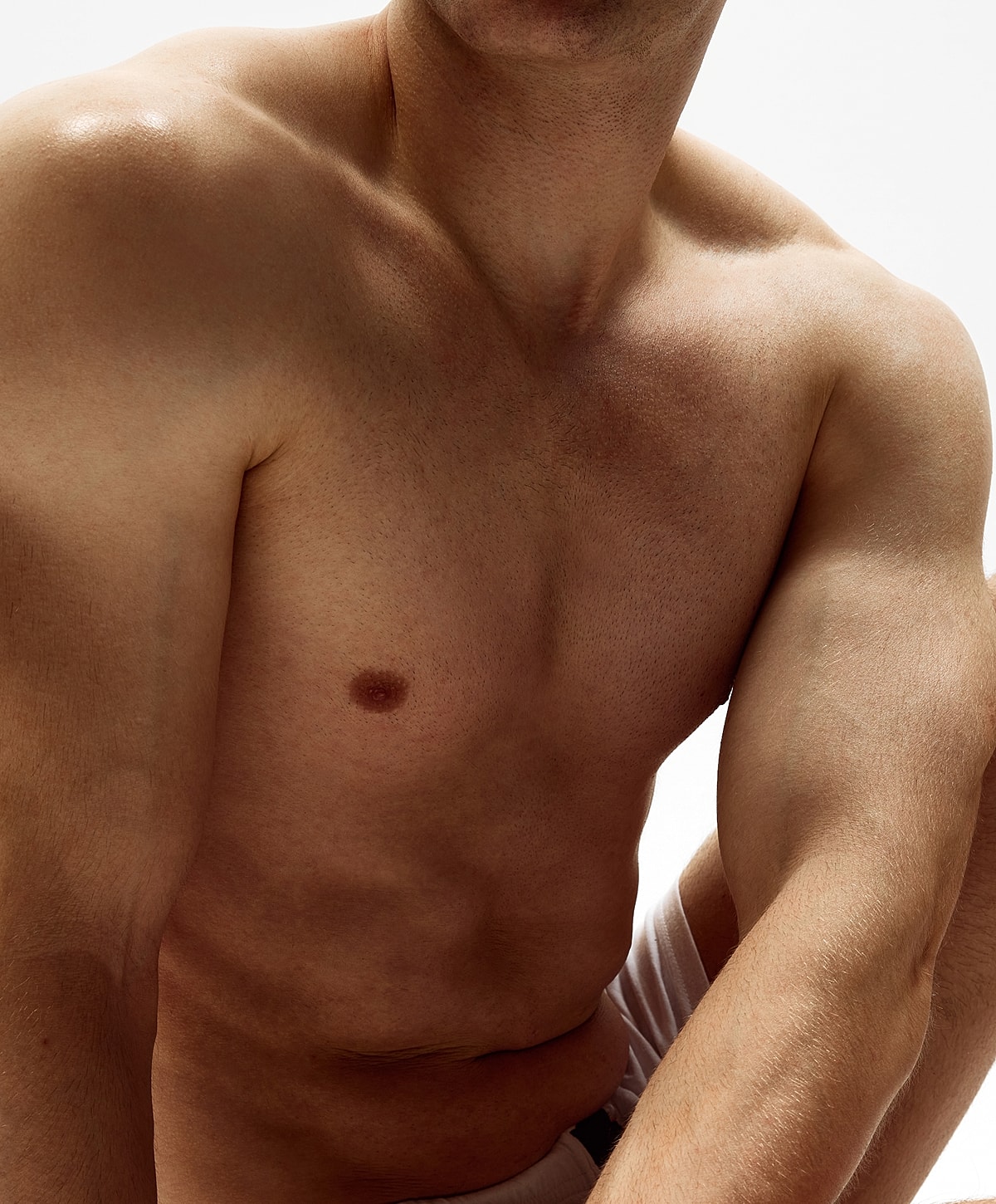 Male torso with light skin and athletic build.