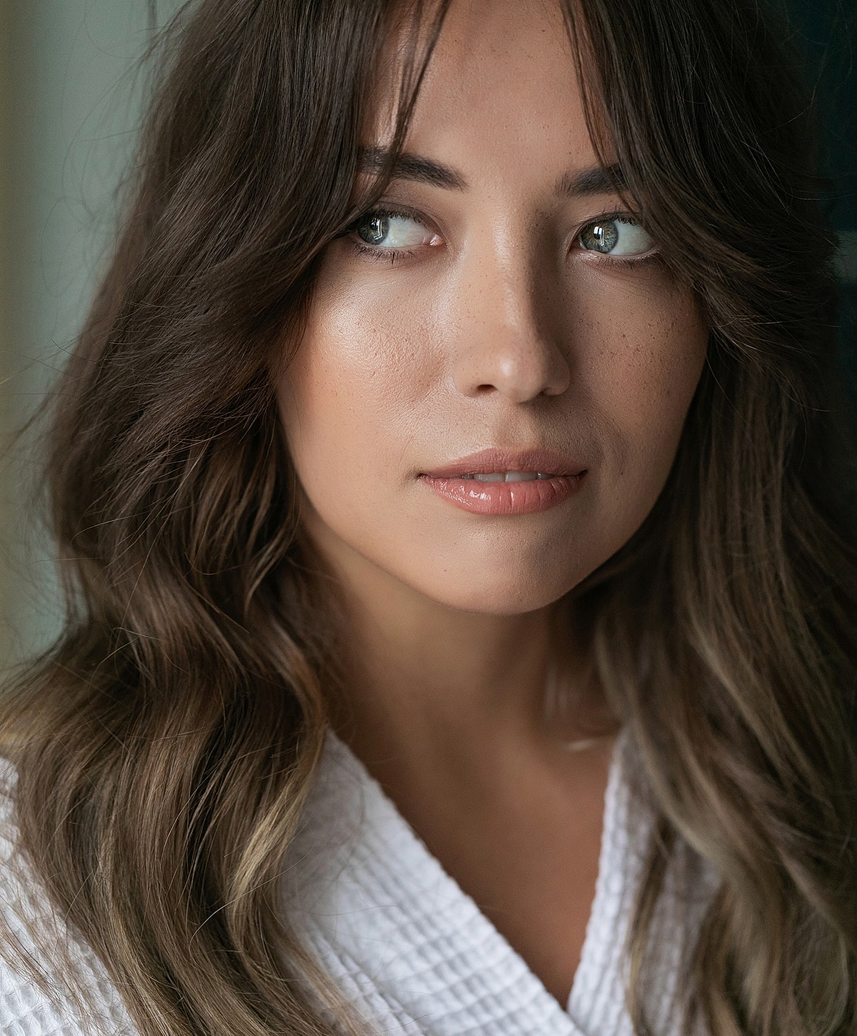 Close-up portrait of a woman with soft features.