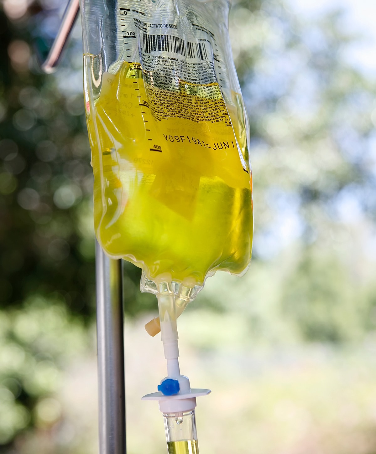 IV bag with yellow liquid on stand
