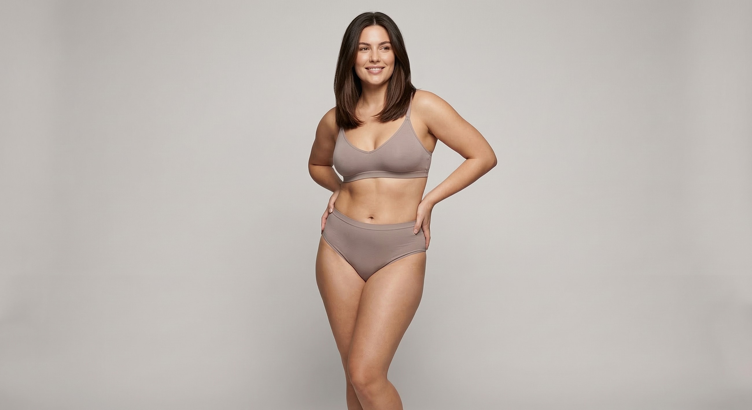 Model in beige bra and high-waisted underwear.